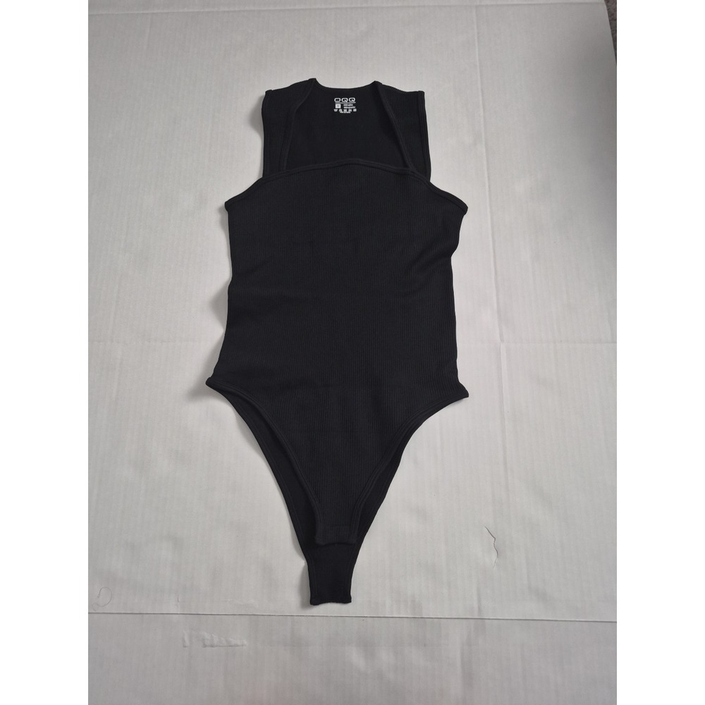 OQQ Women's Black Ribbed Stretch Bodysuit Size M Strap Button Accents